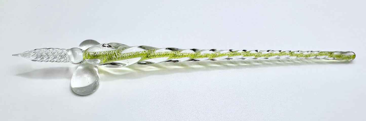 A set of hand-blown glass calligraphy quills in various colors, displayed in a black gift box with each color of ink represented.