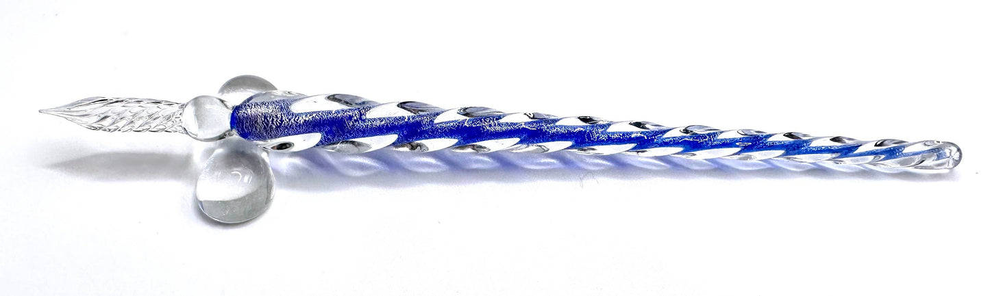 A set of hand-blown glass calligraphy quills in various colors, displayed in a black gift box with each color of ink represented.