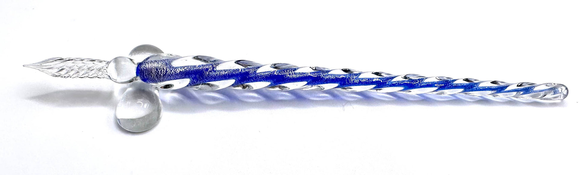 A set of hand-blown glass calligraphy quills in various colors, displayed in a black gift box with each color of ink represented.